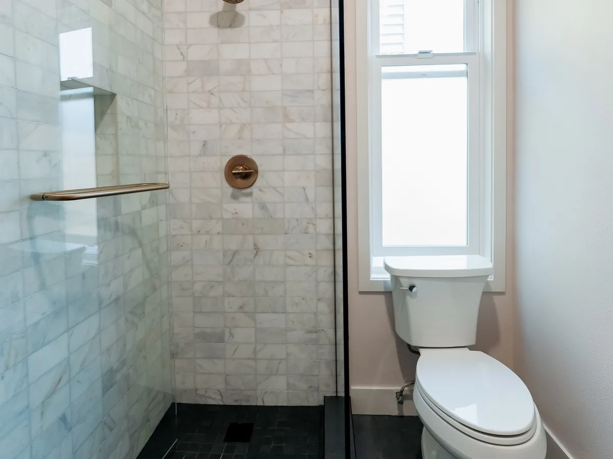 marble & brass shower bath in Capitol Hill, Seattle