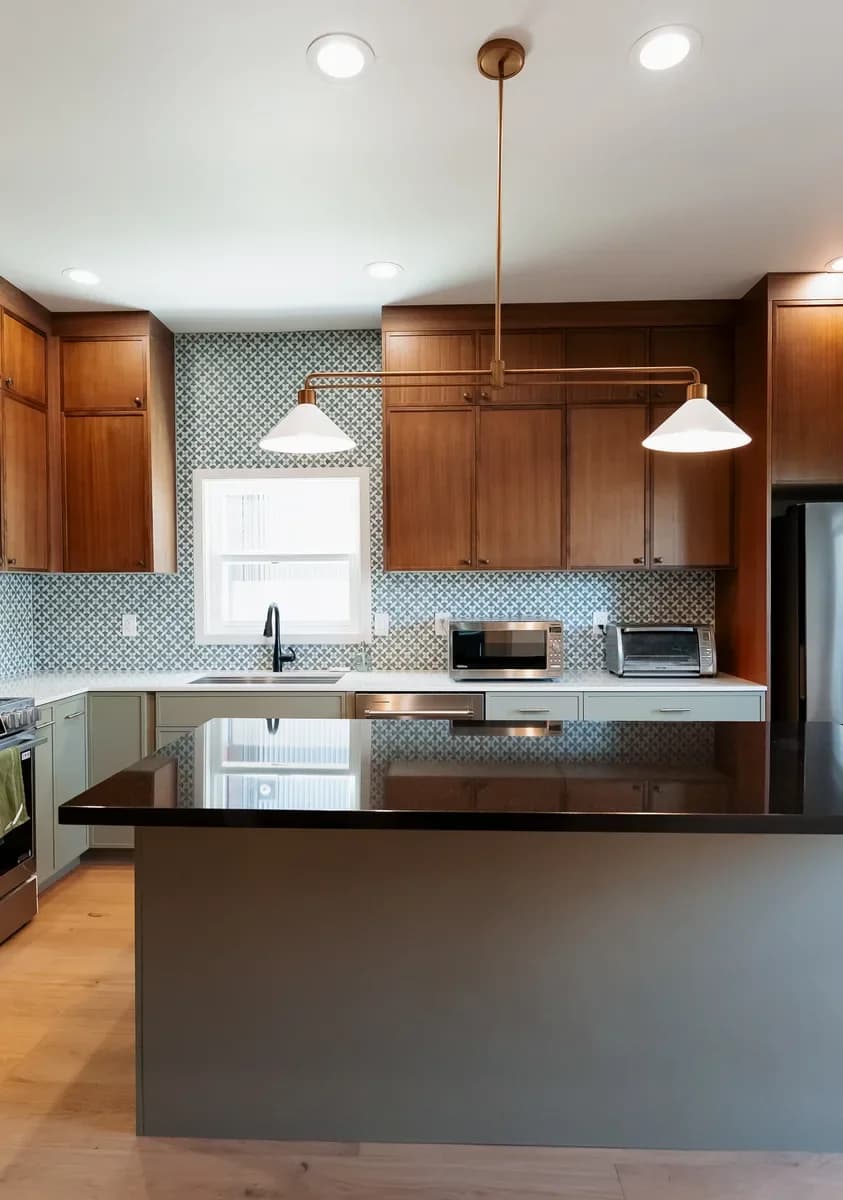 Walnut and sage kitchen with black quartz island on Capitol Hill, Seattle