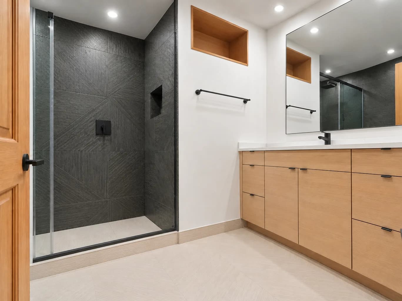 Finished Redmond main bathroom with charcoal tile walk-in shower