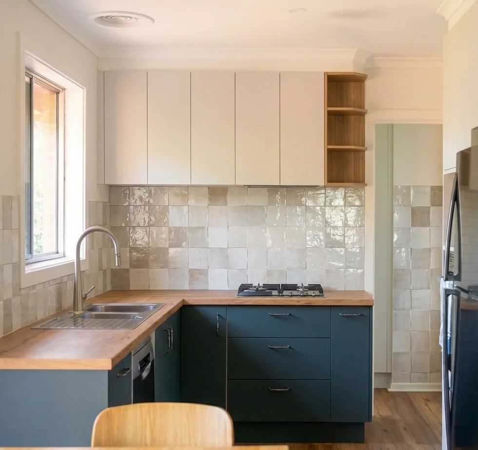 Cottage kitchen with teal shaker cabinets, butcher block countertops, turquoise tile backsplash, and white upper cabinets — Edmonds WA kitchen remodel