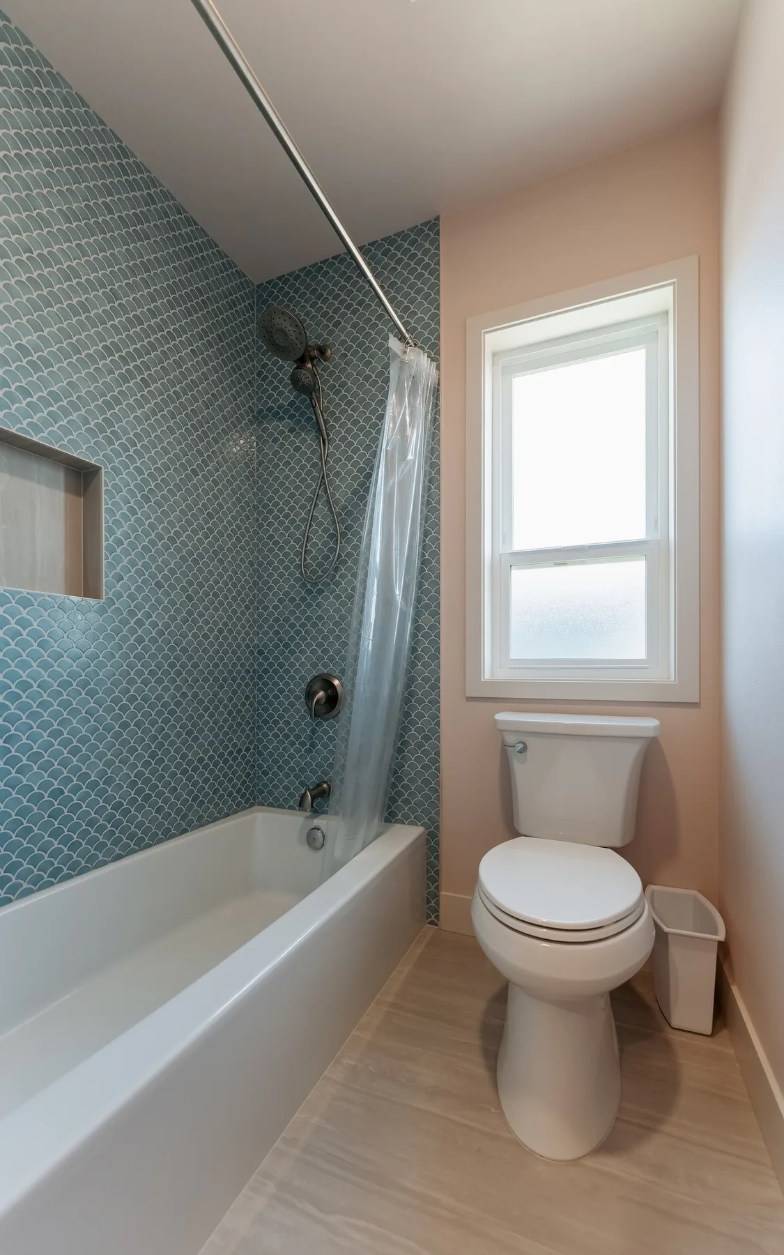 Tub in blue fish-scale tile on the same Capitol Hill floor