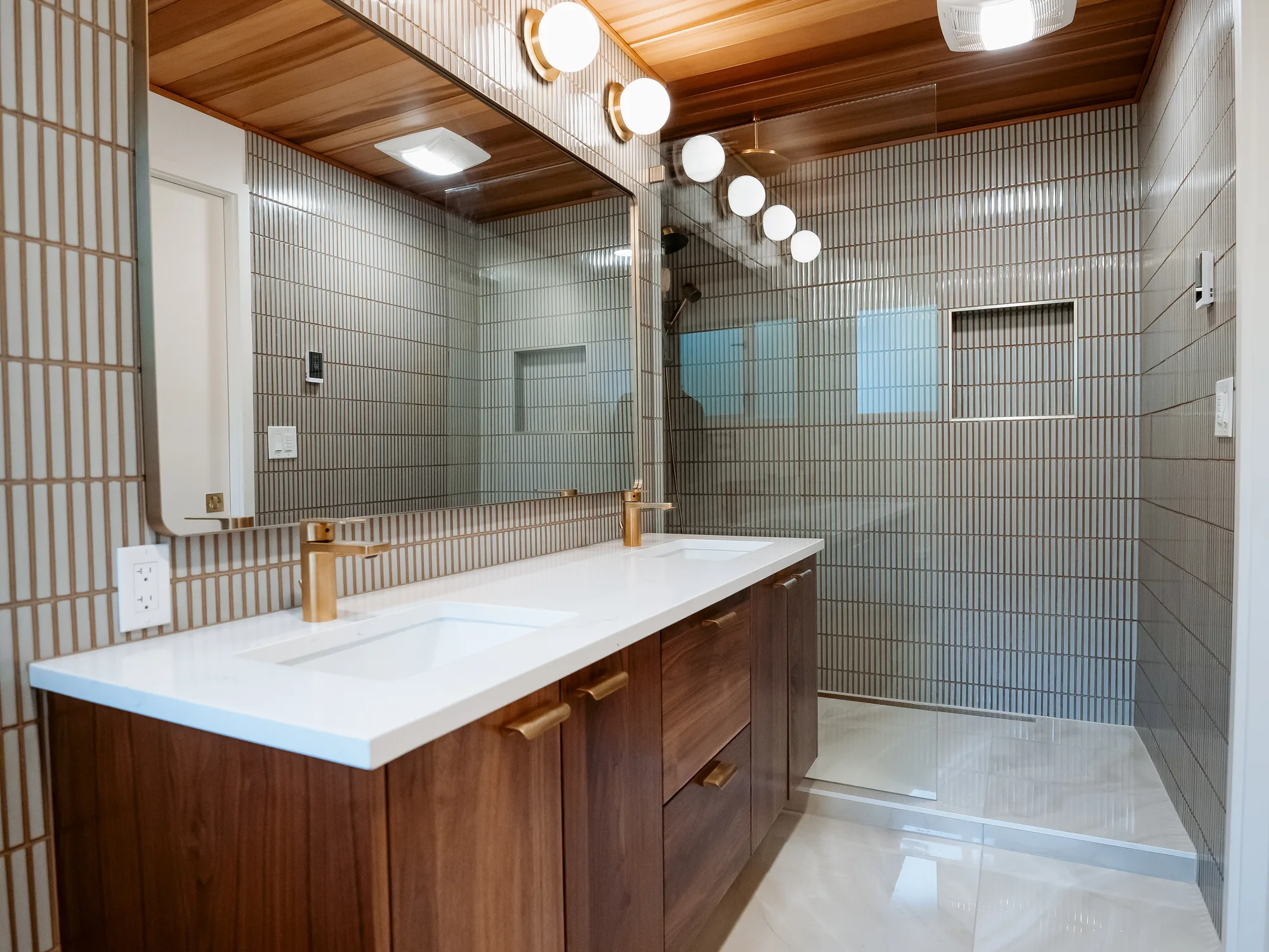 Finished master bathroom with cedar ceiling, walnut floating vanity and white vertical tile in Kirkland, WA