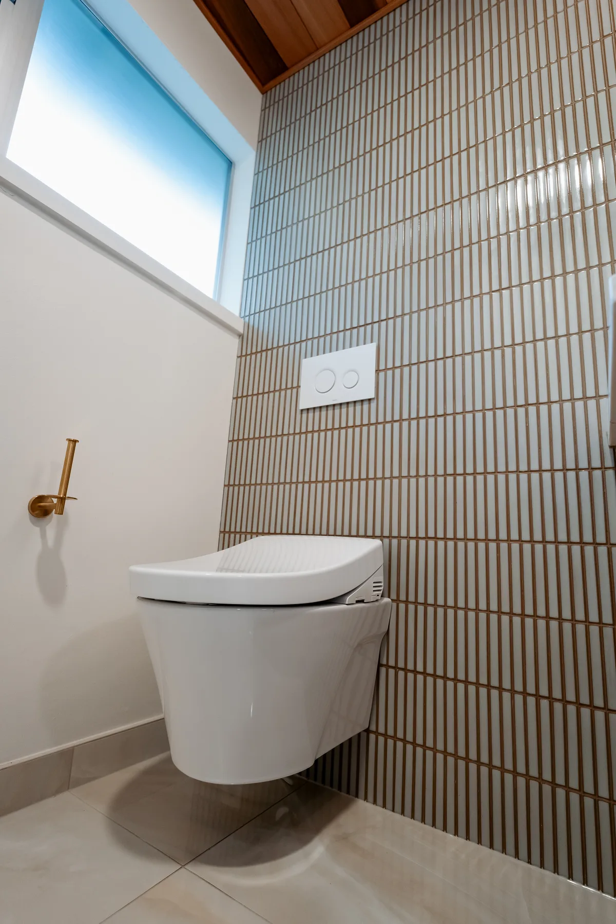 Wall-hung smart toilet with in-wall tank and brass paper holder