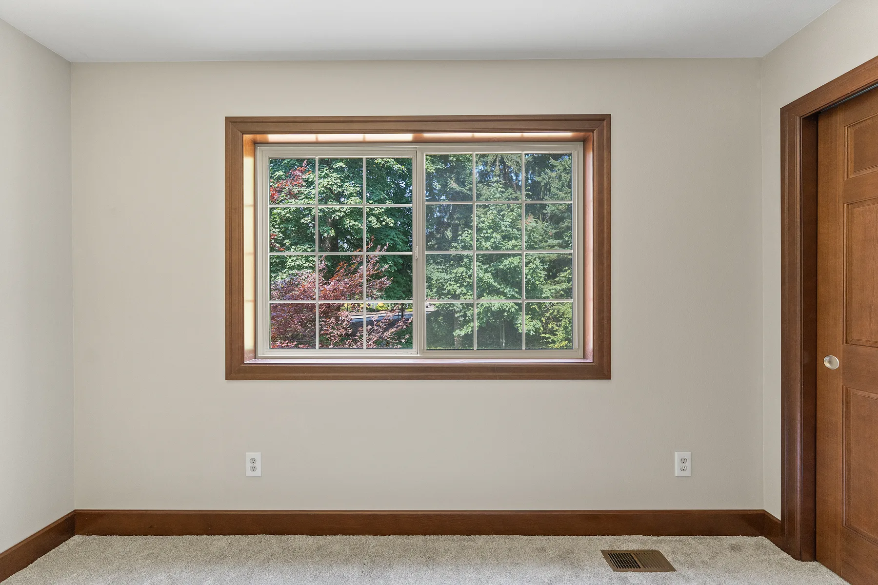 Bedroom with a new window in solid-wood casing, Puyallup, WA