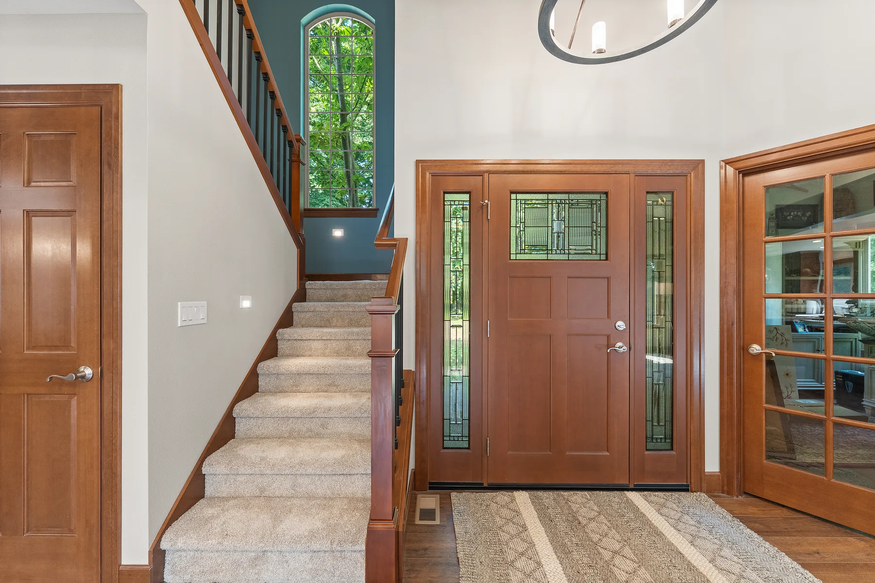 Solid-wood front door with leaded glass and staircase in Puyallup, WA