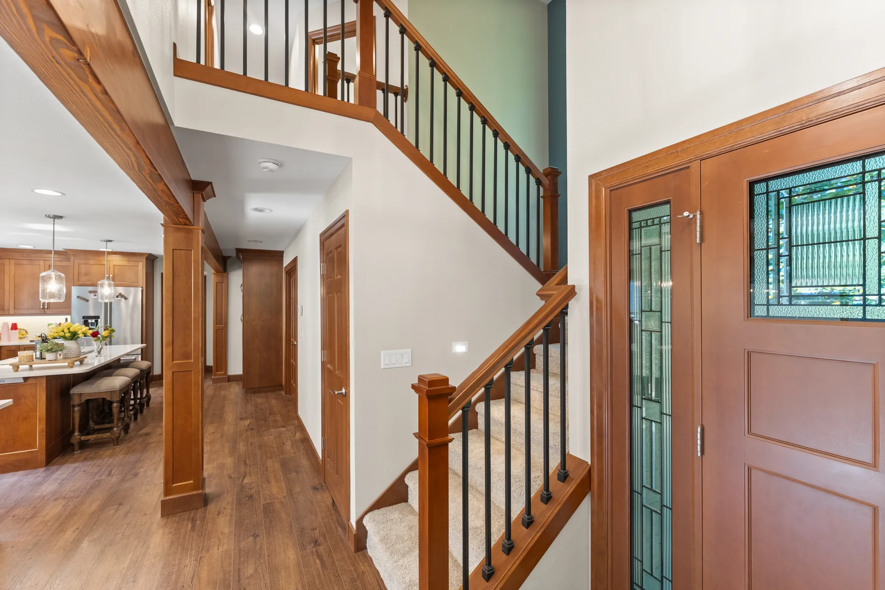 Upstairs hallway with wood floor and solid-wood trim in Puyallup, WA