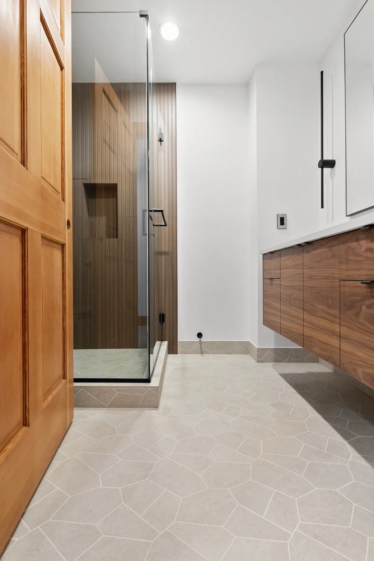 Walk-in shower with glass door and wood-plank porcelain, Redmond WA