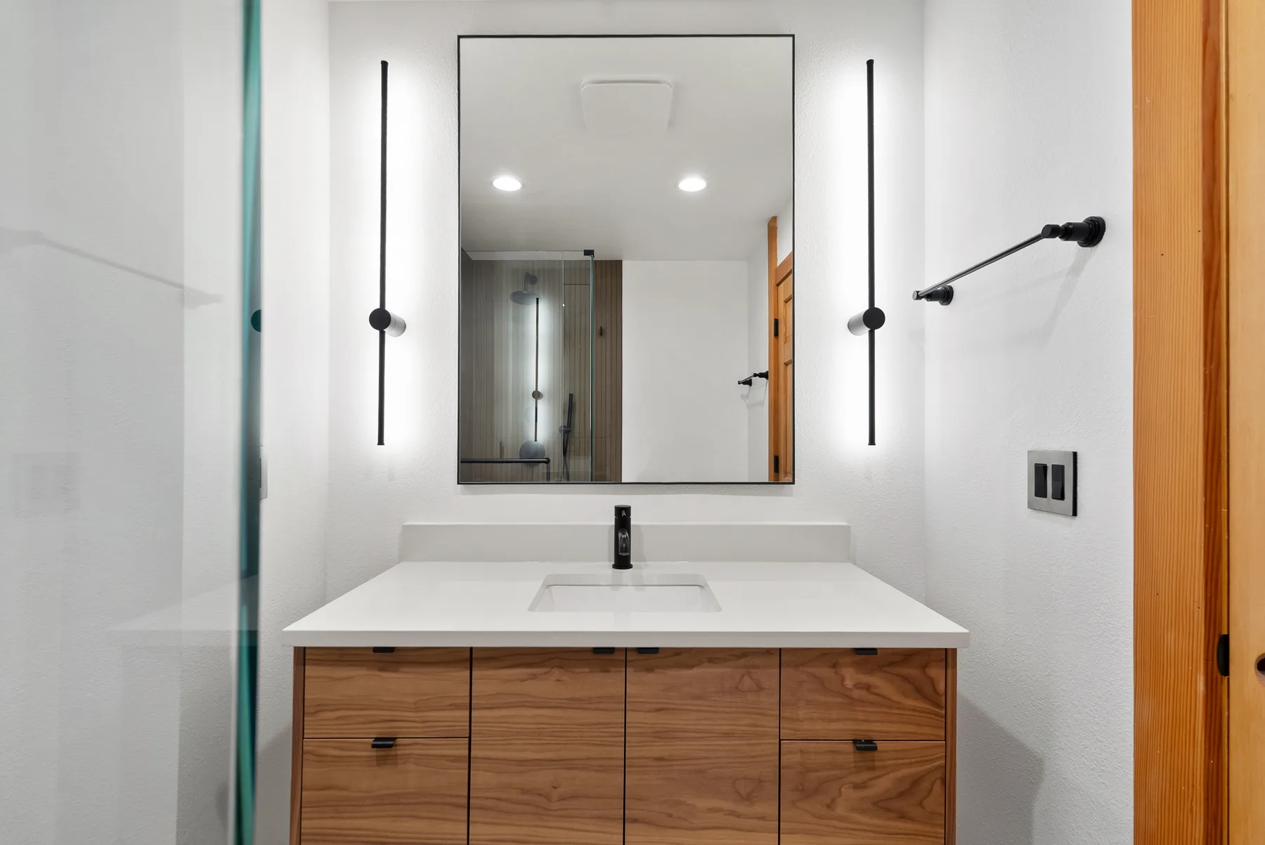 Walnut vanity in the second bathroom converted from a laundry room in the same Redmond home