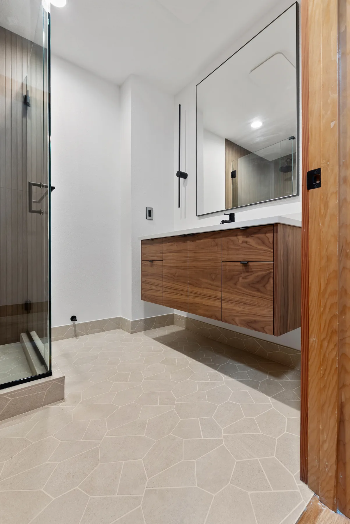 Second full bathroom with wood-plank shower and walnut vanity, Redmond WA