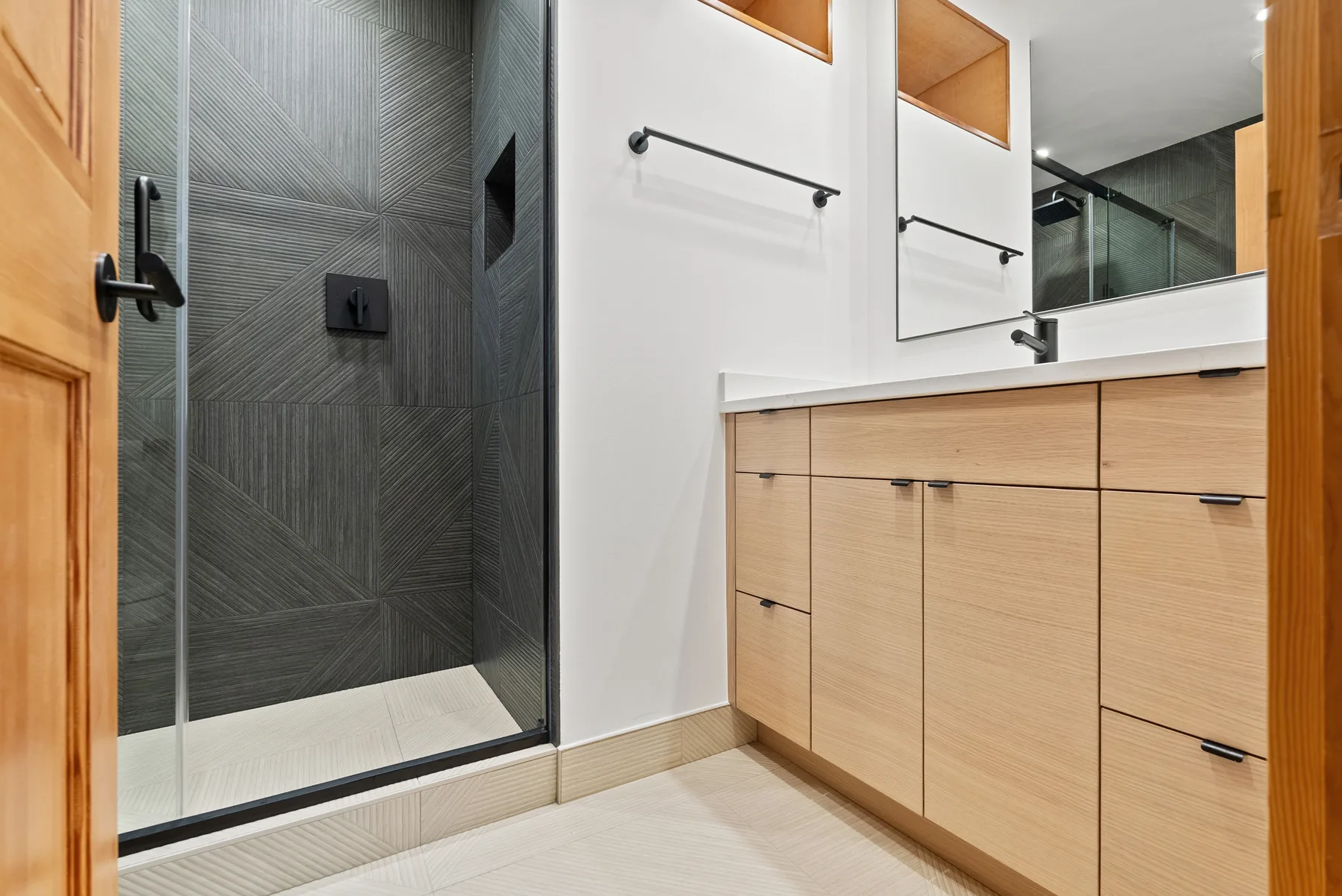 Main bathroom with walk-in charcoal-tile shower and oak vanity, Redmond WA