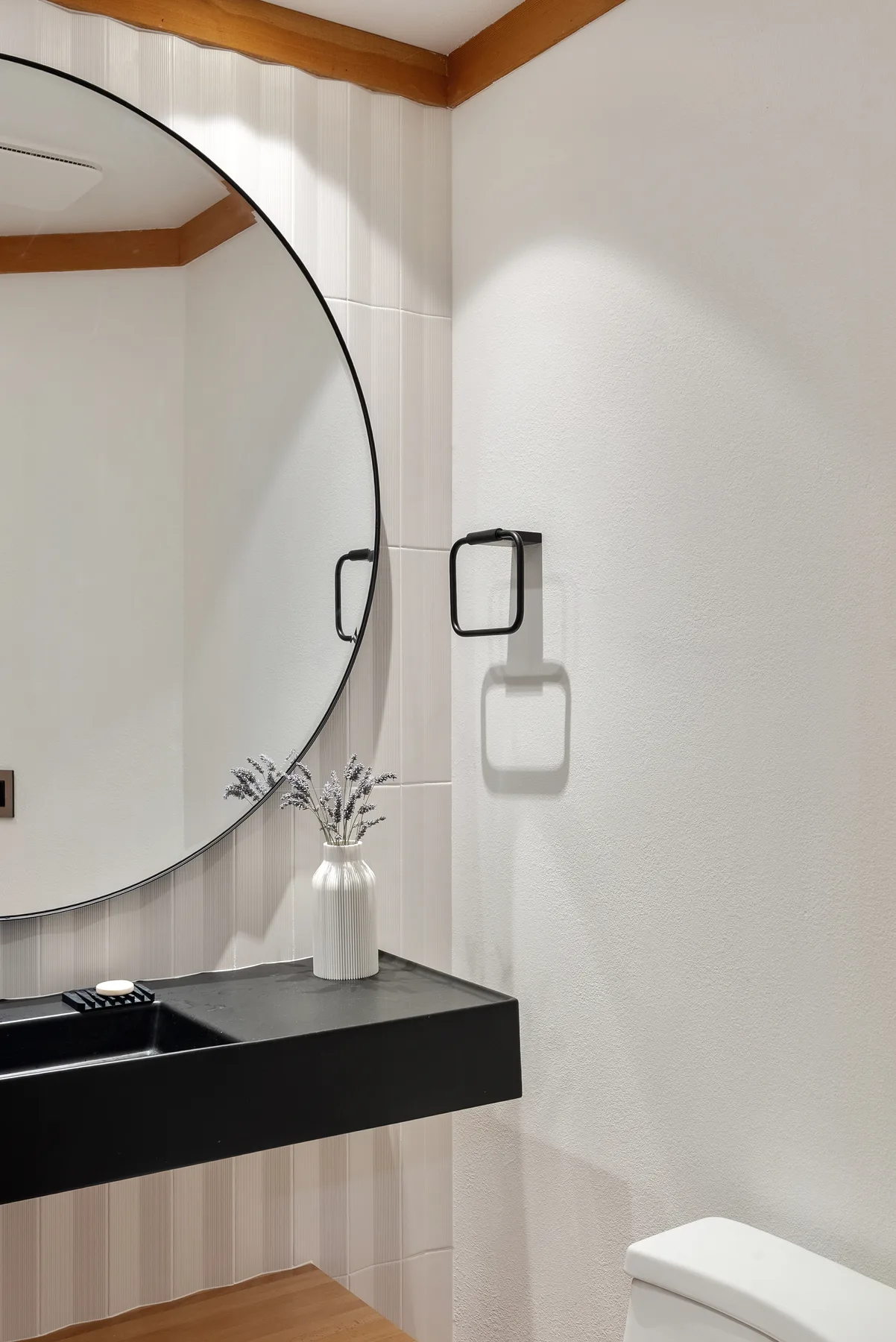 White fluted feature tile and matte-black fixtures, Redmond powder room