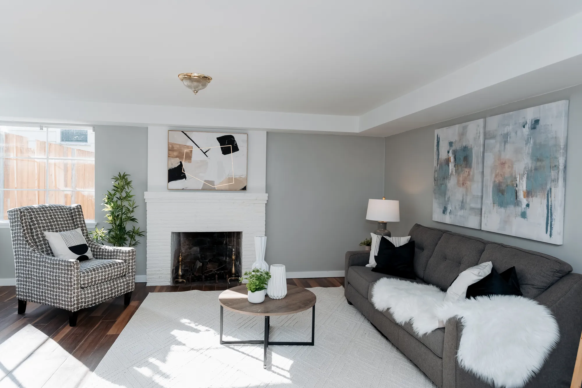 Rec room with fireplace and sofa on the lower level